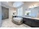 Luxurious bathroom with soaking tub, shower, double vanity, and natural light at 8504 S 30Th St, Phoenix, AZ 85042