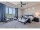 Spacious main bedroom suite with a tray ceiling, bay windows, and furniture set at 8504 S 30Th St, Phoenix, AZ 85042