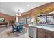 Bright dining area with views of the backyard pool and outdoor seating at 8946 E Voltaire Dr, Scottsdale, AZ 85260