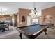 Recreation room featuring a pool table, wet bar, and seating area at 8946 E Voltaire Dr, Scottsdale, AZ 85260