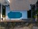 Aerial view of the backyard featuring a sparkling pool and manicured landscaping at 9238 E Palm Tree Dr, Scottsdale, AZ 85255