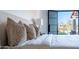 Well appointed bedroom featuring luxe textiles and a door to the outdoor living space at 9238 E Palm Tree Dr, Scottsdale, AZ 85255