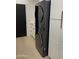 Modern laundry area features a sleek, stacked washer and dryer for convenient and efficient laundry care at 9238 E Palm Tree Dr, Scottsdale, AZ 85255