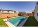 Enjoy summer fun in this pool with artificial grass and great backyard appeal at 9718 E Radioactive Dr, Mesa, AZ 85212