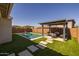 Sparkling pool and outdoor seating area make this backyard an outdoor paradise at 9718 E Radioactive Dr, Mesa, AZ 85212