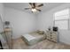 This bedroom features neutral carpet, ceiling fan, and neutral-toned walls at 9718 E Radioactive Dr, Mesa, AZ 85212