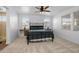 Relaxing main bedroom with ample natural light, ceiling fan, and plush carpet at 9718 E Radioactive Dr, Mesa, AZ 85212