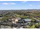 Community aerial showcasing a large pool, clubhouse, and well-maintained landscaping at 9738 E Tiburon Ave, Mesa, AZ 85212