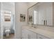 Bathroom featuring a long vanity, a large mirror and view to the toilet with curtain at 9738 E Tiburon Ave, Mesa, AZ 85212