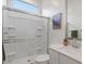 Bathroom featuring a glass enclosed shower, white vanity, and quartz countertop at 9738 E Tiburon Ave, Mesa, AZ 85212