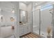 Bathroom featuring a white vanity, glass shower and a view into the bedroom at 9738 E Tiburon Ave, Mesa, AZ 85212