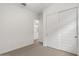 Bedroom featuring carpet floors, a closet and access to another bedroom at 9738 E Tiburon Ave, Mesa, AZ 85212