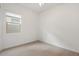 Bright bedroom featuring carpet floors and a window at 9738 E Tiburon Ave, Mesa, AZ 85212
