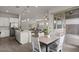 Kitchen and dining area leading to living room and patio at 9738 E Tiburon Ave, Mesa, AZ 85212