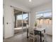Cozy dining area with sliding glass door to patio with a view to the backyard at 9738 E Tiburon Ave, Mesa, AZ 85212