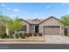 Charming single-Gathering home featuring a two-car garage, neutral paint, and tidy landscaping at 9738 E Tiburon Ave, Mesa, AZ 85212