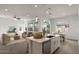 Spacious kitchen island flows into a dining and living area for seamless entertaining and living at 9738 E Tiburon Ave, Mesa, AZ 85212