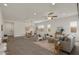 Spacious open-concept living space with tile floors, a dining area, and comfortable seating at 9738 E Tiburon Ave, Mesa, AZ 85212