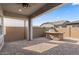 Covered patio with brick flooring and an outdoor kitchen/grilling area, perfect for entertaining at 9738 E Tiburon Ave, Mesa, AZ 85212
