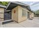 Brick house corner with window, gate and covered patio at 1035 W 2Nd St, Mesa, AZ 85201