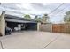 Large open garage with shelving and plenty of space for storage, plus entry to the home at 1035 W 2Nd St, Mesa, AZ 85201