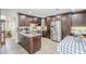 This kitchen features granite countertops, stainless appliances, and stylish dark cabinetry at 1035 W 2Nd St, Mesa, AZ 85201