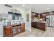 Cozy living room features a flat screen TV and flows seamlessly into the adjacent kitchen at 1035 W 2Nd St, Mesa, AZ 85201