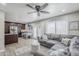 Open-concept living room boasts wood floors, ceiling fan, and cozy seating at 1035 W 2Nd St, Mesa, AZ 85201