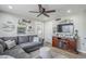 This well-lit living room has wood floors, and a cozy sectional for relaxing at 1035 W 2Nd St, Mesa, AZ 85201