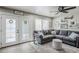 This inviting living room has lots of natural light, wood floors, and cozy seating at 1035 W 2Nd St, Mesa, AZ 85201