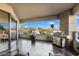 Spacious balcony with comfortable seating, BBQ grill, and a view of trees, perfect for relaxing or entertaining at 1040 E Osborn Rd # 203, Phoenix, AZ 85014