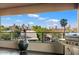 Inviting balcony with tiled floor, city views, a grill, and plants, ideal for outdoor living at 1040 E Osborn Rd # 203, Phoenix, AZ 85014