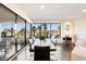 Elegant dining room featuring a modern glass table set, with expansive outdoor scenery visible at 1040 E Osborn Rd # 203, Phoenix, AZ 85014