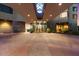 Elegant entrance with stone and glass, showcasing a covered walkway and recessed lighting at 1040 E Osborn Rd # 203, Phoenix, AZ 85014