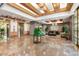 Elegant lobby featuring marble flooring, stylish seating, and decorative plants at 1040 E Osborn Rd # 203, Phoenix, AZ 85014