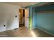 View of an empty bedroom with blue walls with closet and doorway to other rooms at 10951 N 91St Ave # 206, Peoria, AZ 85345