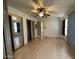 Spacious bedroom with hardwood floors, closet and built-in cabinets, offering comfort and style at 10951 N 91St Ave # 206, Peoria, AZ 85345