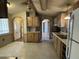 The eat-in kitchen shows wood cabinets and white appliances against a light tile floor at 10951 N 91St Ave # 206, Peoria, AZ 85345