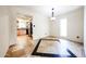 Open dining area shows tile flooring, a modern chandelier, and kitchen access at 11221 N 32Nd St, Phoenix, AZ 85028