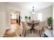 Bright dining room featuring a round table, elegant chairs, and a view to the kitchen at 11221 N 32Nd St, Phoenix, AZ 85028