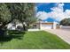 Charming single-story home featuring a well-manicured lawn and an attached two-car garage at 11221 N 32Nd St, Phoenix, AZ 85028