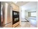 Stainless steel refrigerator and built-in microwave oven in the kitchen at 11221 N 32Nd St, Phoenix, AZ 85028