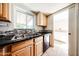 Updated kitchen featuring stainless steel sink and black countertops at 11221 N 32Nd St, Phoenix, AZ 85028