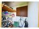 Interior of the storage shed showing shelving filled with pool and home maintenance products at 11221 N 32Nd St, Phoenix, AZ 85028