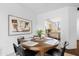 Dining area near the kitchen, featuring round table and modern art at 11515 N 91St St # 142, Scottsdale, AZ 85260