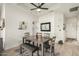 Inviting dining area with seating, a stylish rug, and modern lighting fixture at 11779 E Becker Ln, Scottsdale, AZ 85259