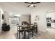 Dining room view with modern flooring, open to living room, patio and kitchen at 11779 E Becker Ln, Scottsdale, AZ 85259