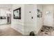 Bright entryway featuring modern flooring and a view into the kitchen with stainless steel appliances at 11779 E Becker Ln, Scottsdale, AZ 85259