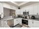 Well-appointed kitchen featuring granite countertops, stainless steel appliances, and modern fixtures at 11779 E Becker Ln, Scottsdale, AZ 85259