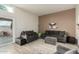 Comfortable living room with plush gray sofas and ottoman, offering a relaxing space at 11779 E Becker Ln, Scottsdale, AZ 85259